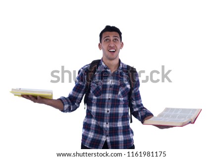Happy student wearing casual outfit holding two open books in his hands and laughing, isolated on white background.