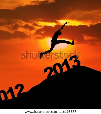 Man jump over 2013 number to embrace the new year Royalty-Free Stock Photo #116198857