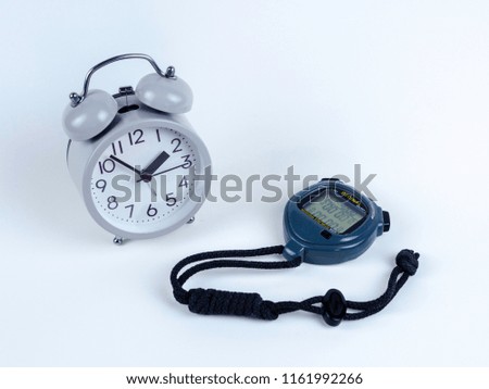 Analog clock and stopwatch on the white background
