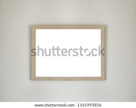 wooden blank frame for photograph on wall