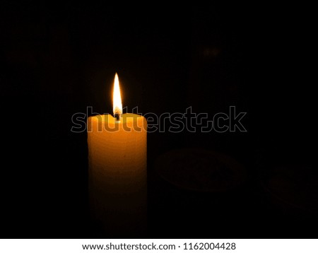 close up candle flame black background.