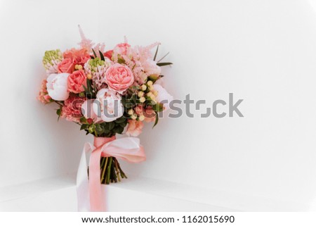 Wedding flowers, bridal bouquet closeup. Decoration made of roses, peonies and decorative plants, close-up, white background. copy spase