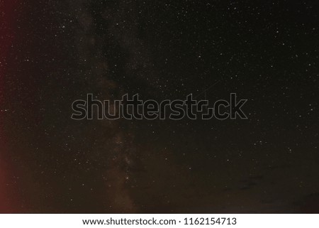 Photo two falling stars and of Milky Way in the beautiful starry sky