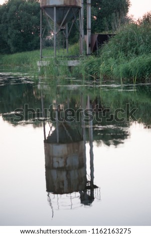 Water tower at Lake Royalty-Free Stock Photo #1162163275