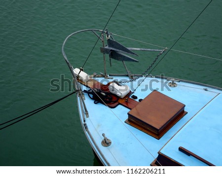 The Bow of an Old Wooden Boat, Showing the Anchor and Windlass Chain and Ropes, with a Beautiful Wooden Hatch.