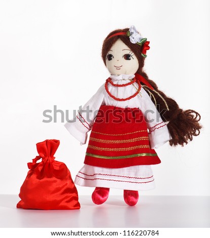 Pretty stuffed doll in red saran