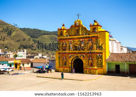 The picturesque church of El Calvario is located in San Andres Xecul, Totonicapan Guatemala.Built on the XVII century its architecture and details of the facade represent saints, animals, fruits, etc. Royalty-Free Stock Photo #1162213963