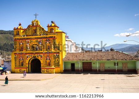 The picturesque church of El Calvario is located in San Andres Xecul, Totonicapan Guatemala.Built on the XVII century its architecture and details of the facade represent saints, animals, fruits, etc. Royalty-Free Stock Photo #1162213966