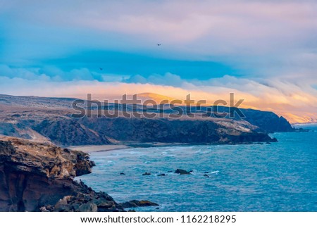 sunset after the storm on the cliff of the ocean beach of the Pared island Fuerteventura Canary archipelago in Spain