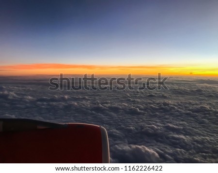 Beautiful Sunrise upper a clouds from the airplane window.