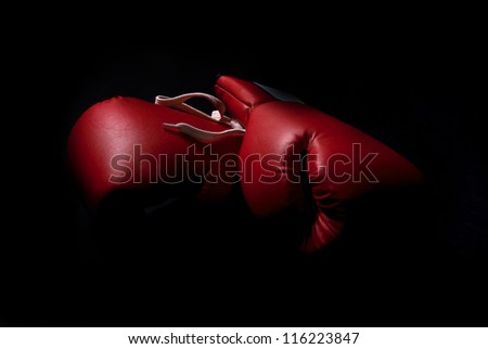 boxing gloves isolated in black Royalty-Free Stock Photo #116223847