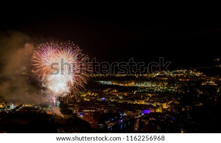 Landscape of the city of Bilbao at night. Fireworks of the big week of the city