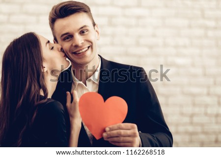 Happy Couple With Red Heart Origami. Valentine's Day. Love Each Other. Beautiful Holiday. Sweetheart's Celebration Concept. Young And Handsome. Feelings Showing. Cheerful Lovers. Romantic Kiss. Royalty-Free Stock Photo #1162268518