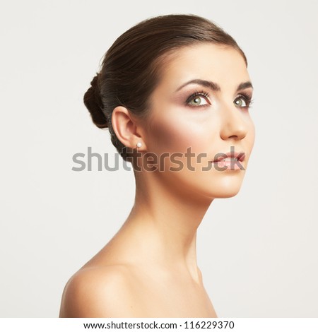Close up portrait of beautiful young woman face. Isolated on white background. Portrait of a female model.