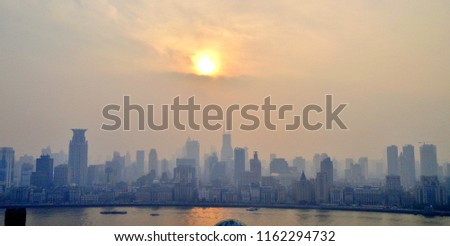 Artistic Panoramic View (Aerial Shot) of Downtown Shanghai, with a Hazy Sun Slowly Setting Beyond - Shanghai, China 
