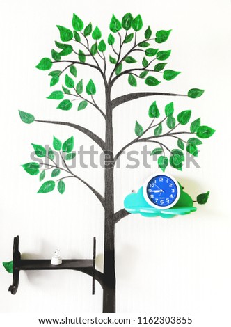 Picture of a tree on a white wall