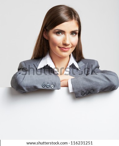 Smile Business woman portrait with blank white board on gray isolated . Female model with long hair.