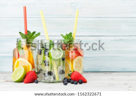 Fresh lemonade jar with summer fruits and berries. With space for your text