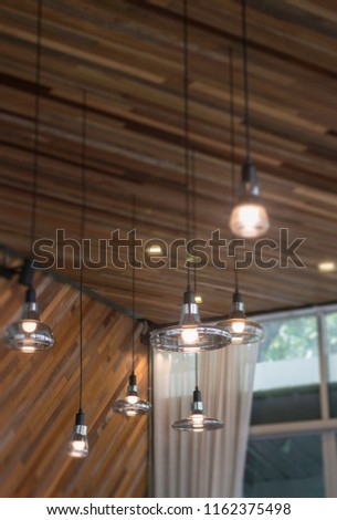 Vintage light bulbs hanging from ceiling, stock photo