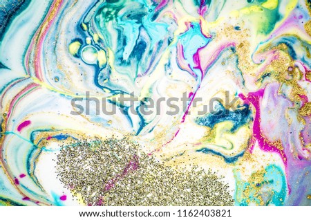 Magic unique painting. Mixed paints,  gold metallic paint. Paper marbling is a method of aqueous surface design, which can produce patterns similar to smooth marble or other kinds of stone.