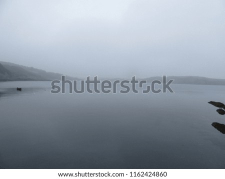 Misty morning coastal landscape
