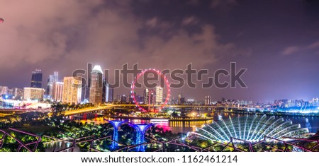 Aerial panaromic view of  colorful Singapore's skyline and Buildings  at night illuminated with lights, Singapore