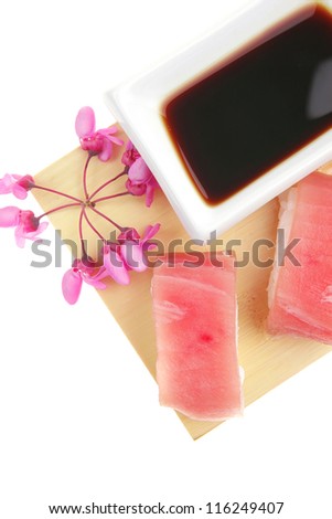 Nigiri Sushi - Set of Nigiri sushi topped with raw Tuna (maguro) . Isolated over white background . on wooden board