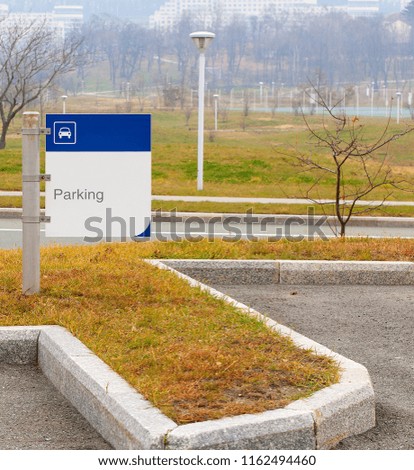 parking sign in the park in autumn