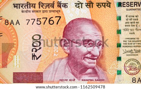 Mahatma Gandhi face on India 200 rupee (2017) banknote close up, Indian  money closeup Royalty-Free Stock Photo #1162509478