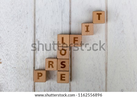Wooden blocks on white wooden background. Business concept.