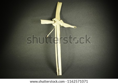 Palm Tree Leaf Easter Cross Royalty-Free Stock Photo #1162571071