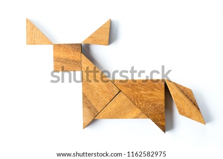 Wood tangram puzzle in buffalo or bull shape on white background