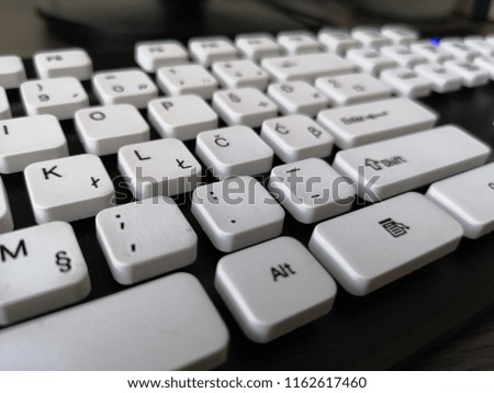 White keyboard. White keys, black background