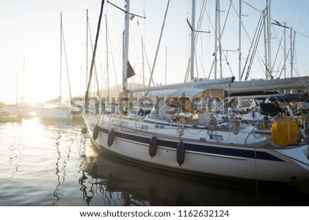 Picture of row of sailboats reflected in water
