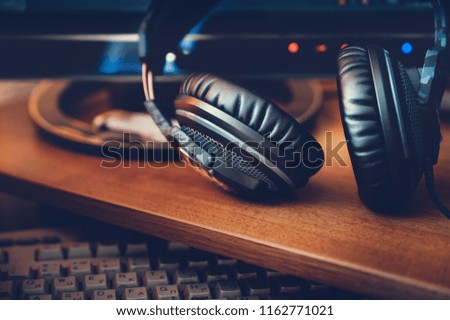 Headphones on the computer desk with toning