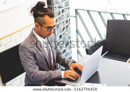 business man working with documents and laptop