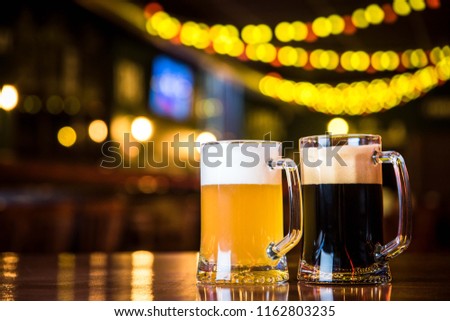 light and dark beer on a pub background.