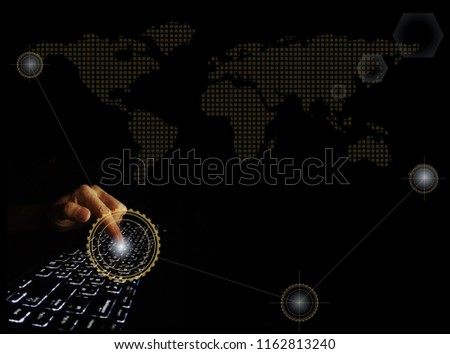 typing hand over a keyboard showing the meaning of further impact at global level, demonstrated by the dotted world map