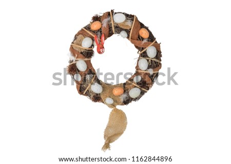 Easter willow wreath with eggs and wooden easter bunny isolated on white background. Happy easter.