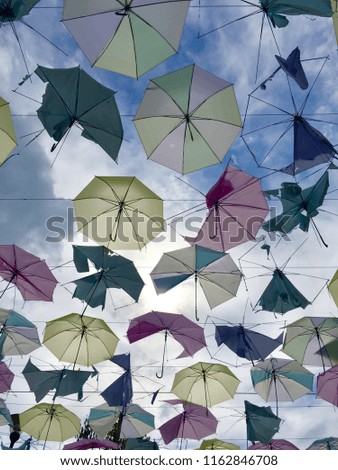 Umbrella colorful pastel background and sky blue