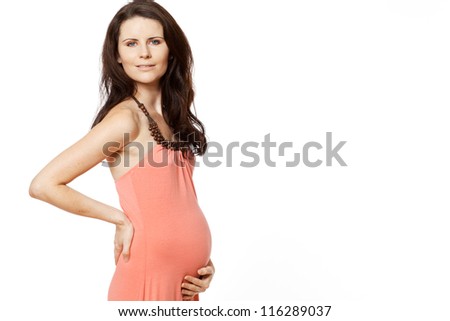 Young beautiful pregnant woman with long dark hair.