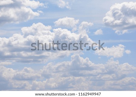 White big clouds on a blue sky. A beautiful natural phenomenon.