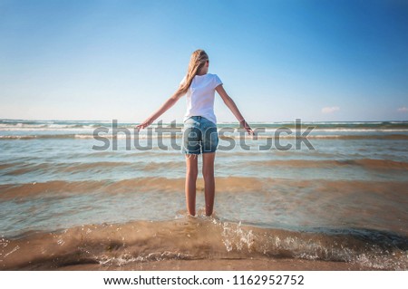 Girl on the sea. Thinking. Conceptual photography