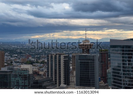 Aerial view of Downtown City during a stormy summer evening before sunset. Taken in Vancouver, British Columbia, Canada.