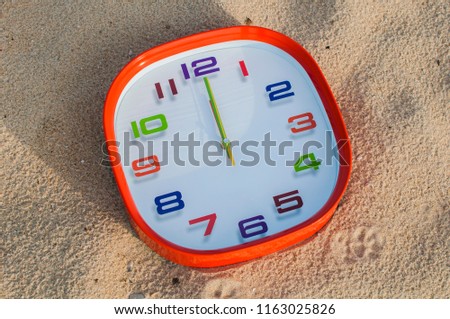 12 o'clock over the sand background