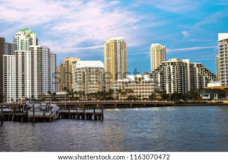 Beautiful view from sea, sky, boats, and office buildings during sunset in Brickell, Miami, United States