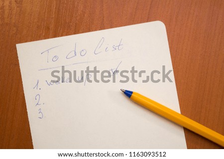 A to do list on the wooden background