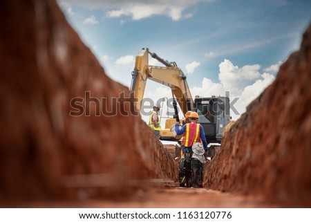 Group of worker and construction engineer wear safety uniform excavation water drainage at construction site Royalty-Free Stock Photo #1163120776