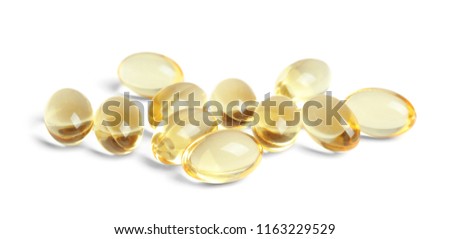 Cod liver oil pills on white background