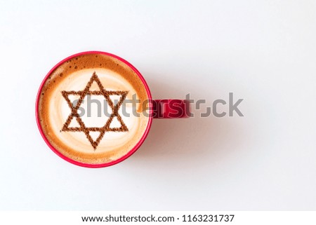 a cup of coffee in Israel cappuccino with a picture of the star of David